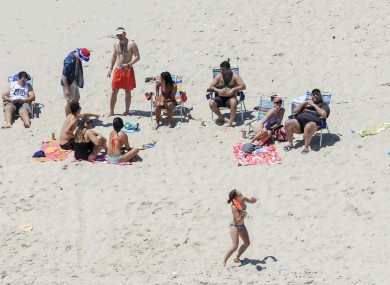 Governor Chris Christie, right, uses the beach with his family and friends at the governor's summer house at Island Beach State Park in New Jersey.