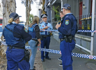 Police officers outside an address as part of counter terror raids in Sydney