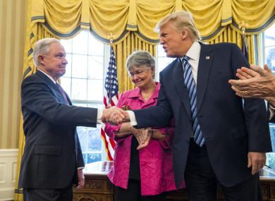 US President Donald Trump shakes hands with Attorney General Jeff Sessions