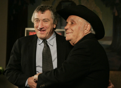 Robert DeNiro and boxer Jake LaMotta stand for photographers before watching a 25th anniversary screening of the movie Raging Bull in New York in 2005.