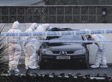 Gardai examine a car in the wake of the 2013 shooting at the Huntsman Inn.
