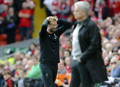 Klopp with Mourinho in the foreground.