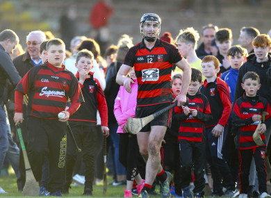 Ballygunner's Pauric Mahony is surrounded by supporters at the end of the game.