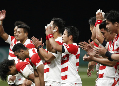 Japan's rugby team greets supporters at the end of their rugby union international match against France at the U Arena.