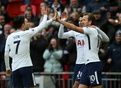 Tottenham Hotspur's Harry Kane (right) celebrates scoring his side's fifth goal of the game.