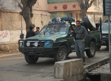 Afghan security force members arrive at the site of an attack in Jalalabad city, Afghanistan