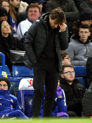 Chelsea manager Antonio Conte appears dejected on the touchline.