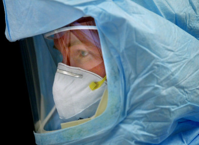 A doctor prepares to treat a high-risk Sars patient in Toronto.