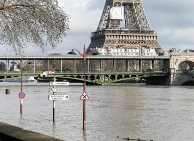 A flooded bank of the Seine in front of the Eiffel tower in Paris yesterday.