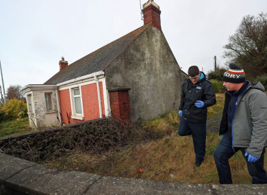 Garda searching a vacant property in Dundalk close to the scene of the murder of a Japanese man.
