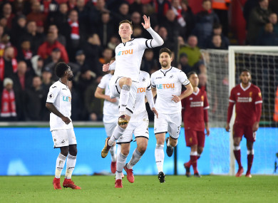 Swansea City's Alfie Mawson (centre) celebrates scoring his side's opener.