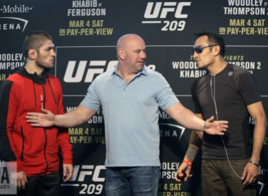 UFC president Dana White stands between Tony Ferguson, right, and Khabib Nurmagomedov.