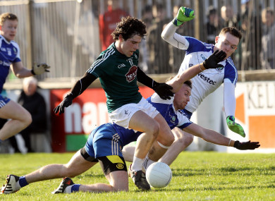 Chris Healy's shot is blocked by Fintan Kelly of Monaghan.