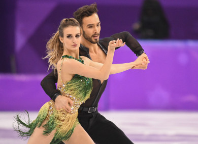 Gabriella Papadakis (Front) and Guillaume Cizeron of France compete during the ice dance short dance of figure skating at the 2018 PyeongChang Winter Olympic Games.