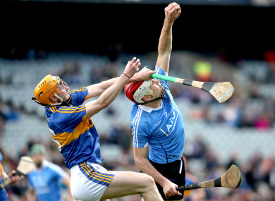 Dublin's Paddy Smyth catches under pressure from Cian Darcy of Tipperary.