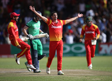 Zimbabwe's Graeme Cremer celebrates.