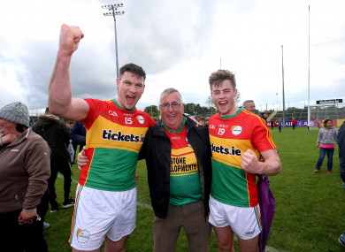Carlow's John Murphy celebrates with Uncle Arthur and Mark Rennick after defeating Wexford in last year's Leinster championship.