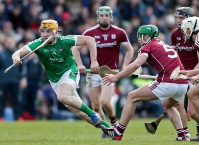 Seamus Flanagan evades the challenge of Greg Lally.