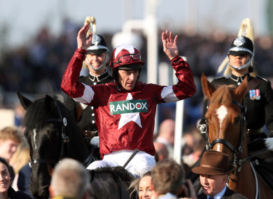 Jockey Davy Russell on Tiger Roll celebrates winning the Randox Health Grand National Handicap Chase.