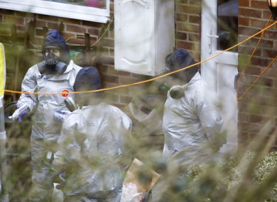Investigators work in the garden of Sergei Skripal's house in Salisbury, southern England, on March 22.