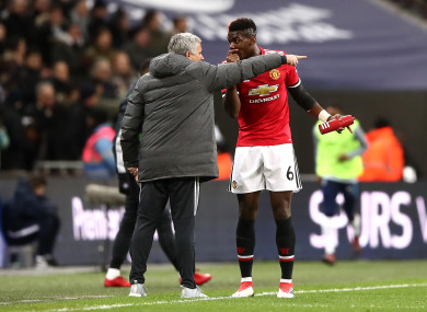 Manchester United manager Jose Mourinho (left) and Paul Pogba talk on the touchline.