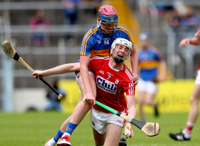 Cian O'Farrell and Cillian O'Donovan battle for possession.