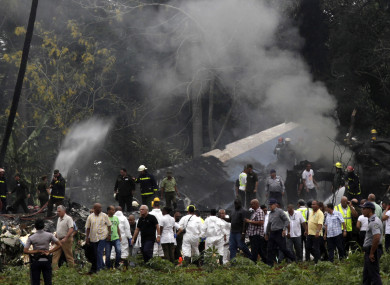 Cuba's President Miguel Diaz-Canel, third from left, walks away from the site.