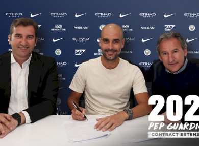 Pep signs his contract extension.
