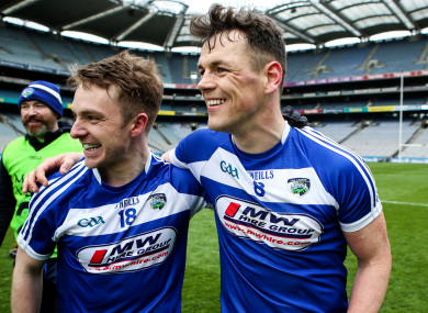 Ross Munnelly celebrating the Division 4 league final win with John O'Loughlin.