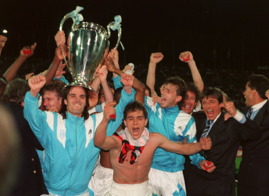 The Olympic Marseille team celebrate with the Champions League trophy.