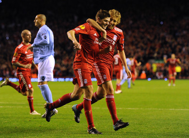 Gerrard and Lucas celebrate a goal back when they were teammates at Liverpool