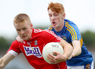 Cork’s Damien Gore with Eanna McBride of Tipperary.