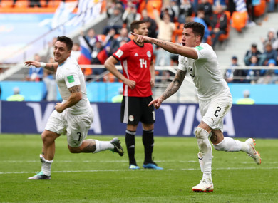 José Giménez celebrates giving Uruguay the lead at the Ekaterinburg Arena.