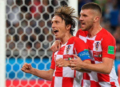 Modric celebrates alongside team-mate Ante Rebic on Saturday.