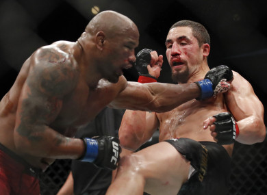 Robert Whittaker, right, and Yoel Romero fight during their middleweight bout at the UFC 225.