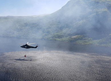 An Air Corps helicopter picking up water to help with firefighting last week.