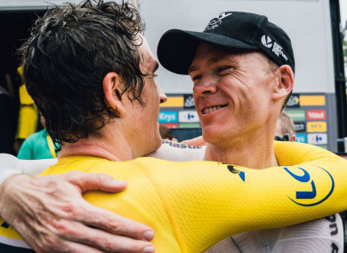 Geraint Thomas and Chris Froome embrace.