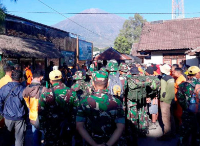 Indonesian soldiers and rescue team gather to prepare for evacuating tourists from Mount Rinjani today.