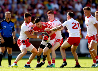 The Tyrone defence apply the pressure on Cork's Luke Connolly.