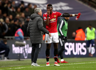Manchester United manager Jose Mourinho (left) and Paul Pogba talk on the touchline.