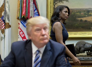 White House Director of communications for the Office of Public Liaison Omarosa Manigault, right, walks past President Donald Trump