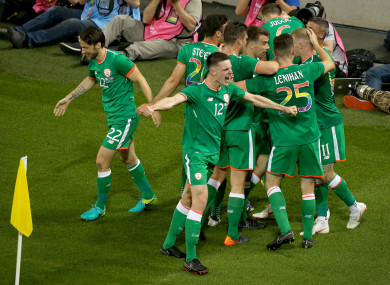 Ireland players celebrate a goal against USA.