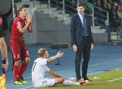 Rangers' head coach Steven Gerrard, right, Rangers' Scott Arfield, centre, Ufa's Dmitri Zhivoglyadov react during the Europa League play-off round.