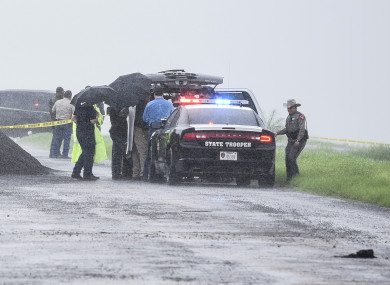 Law enforcement at the scene where the fourth body was found.