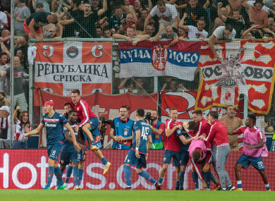 The Red Star players celebrate a goal at Salzburg's Red Bull Arena.