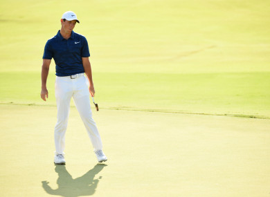 Rory McIlroy reacts to missing a putt on the 18th hole during the second round of the Tour Championship golf tournament at East Lake Golf Club.