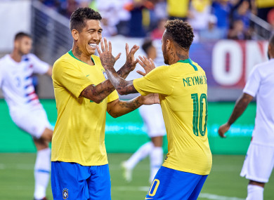 Firmino and Neymar celebrate.