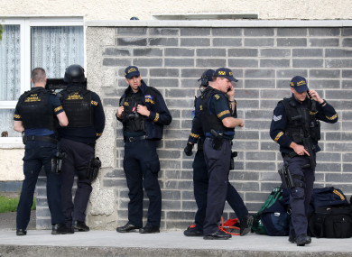 Members of Garda armed support units at the house.
