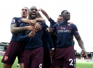 Arsenal players celebrate Alexandre Lacazette's second goal.