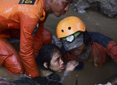 Rescuers save a 15-year old earthquake victim in Sulawesi, Indonesia.
